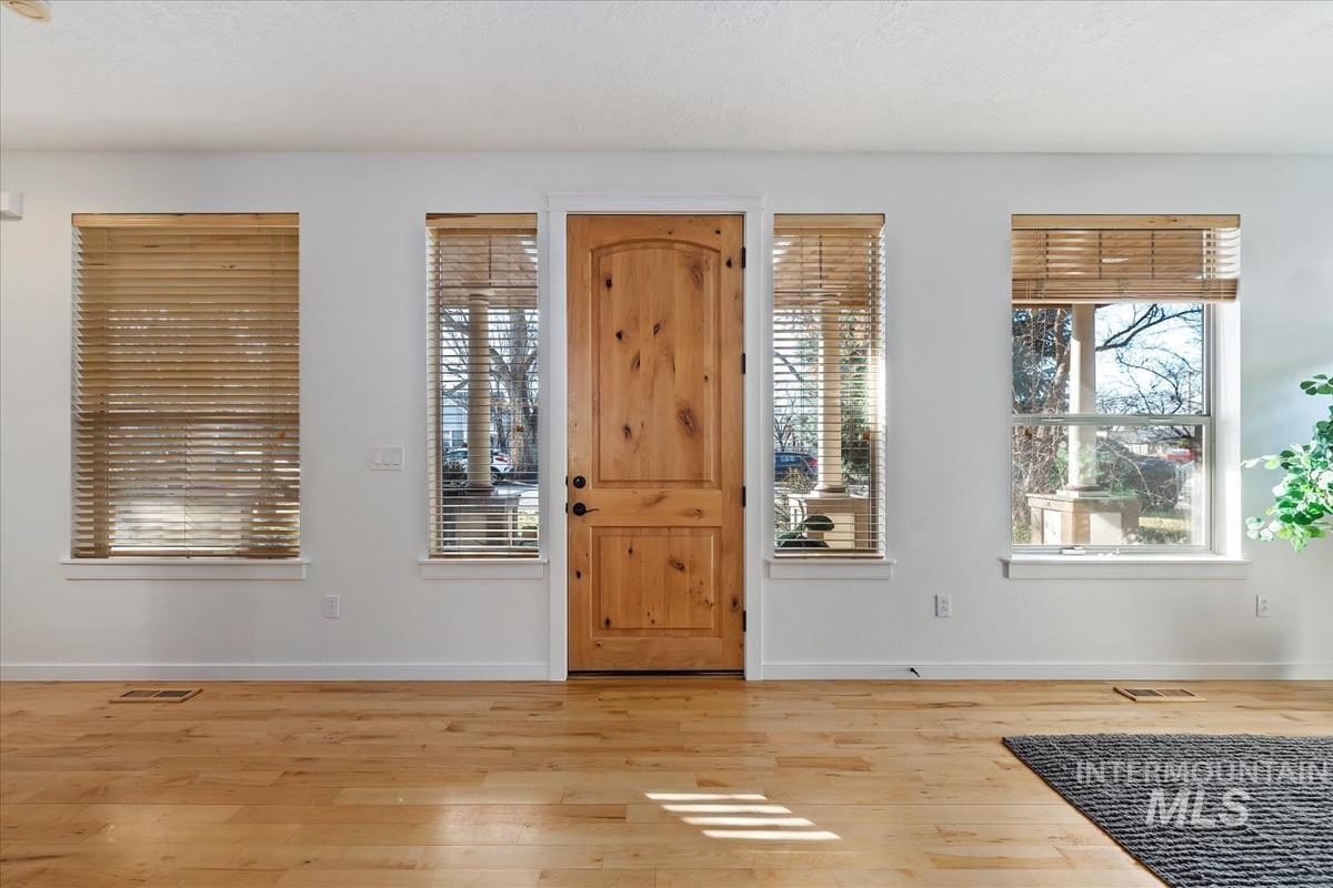 Entryway featuring light wood finished floors and plenty of natural light