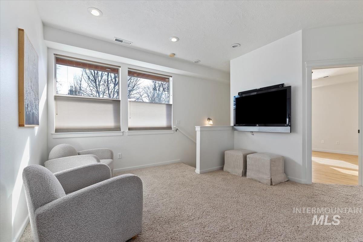 Sitting room featuring carpet floors and recessed lighting