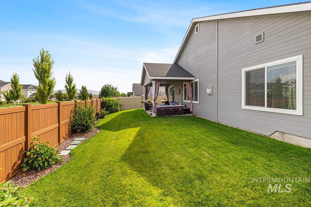 Fenced backyard featuring a patio area