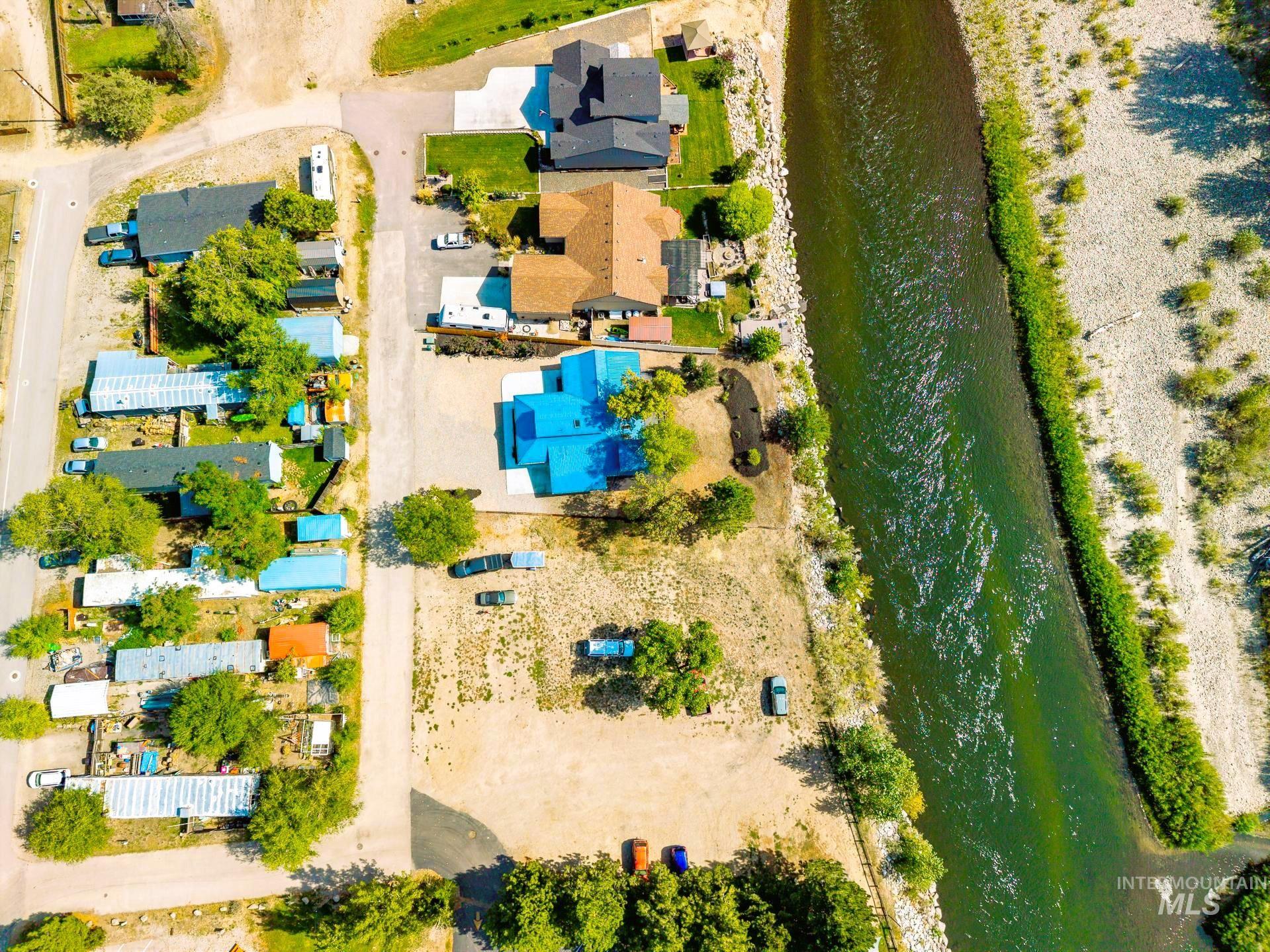 Aerial view of residential area featuring a large body of water