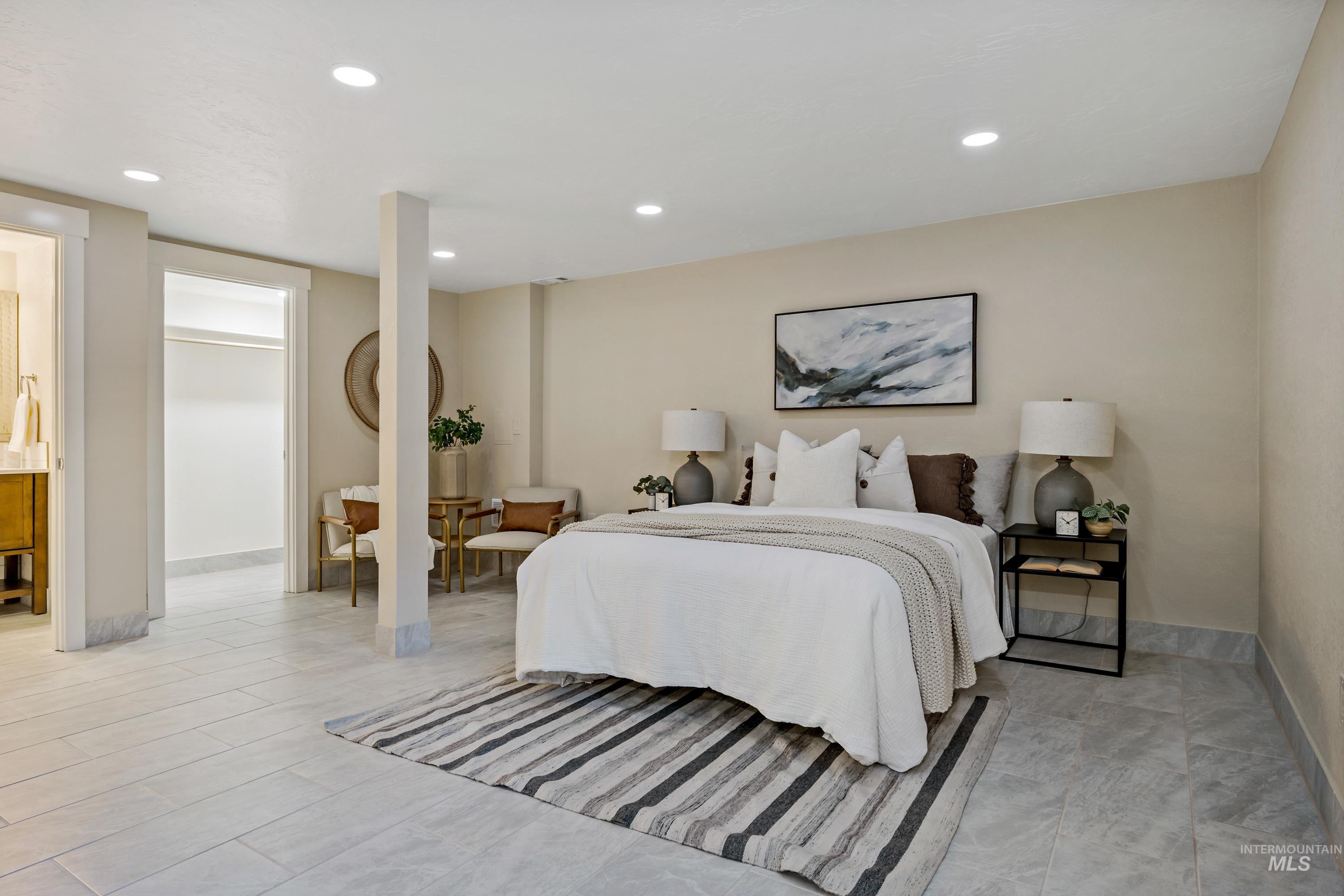 Bedroom with recessed lighting and a walk in closet