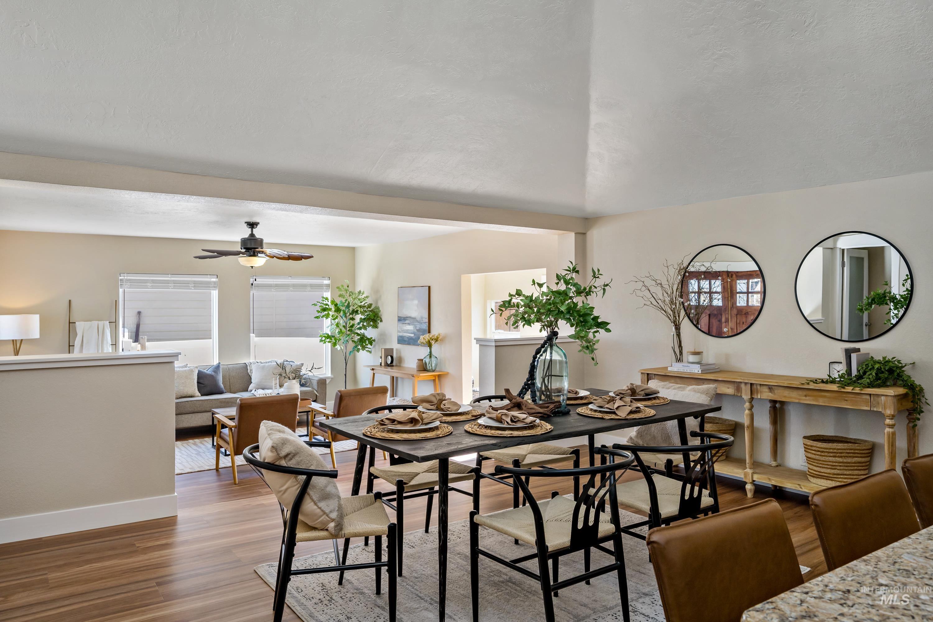 Dining room featuring wood finished floors and a ceiling fan