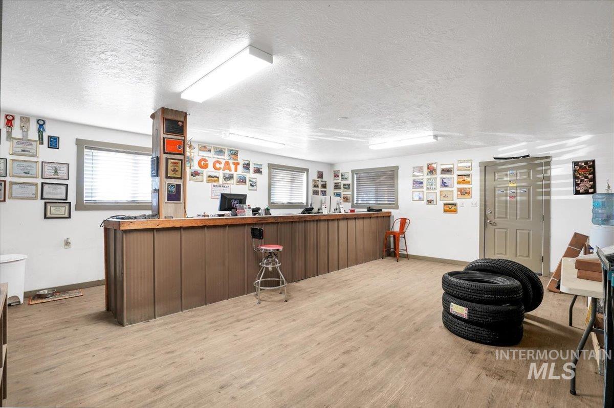 Indoor dry bar with a textured ceiling