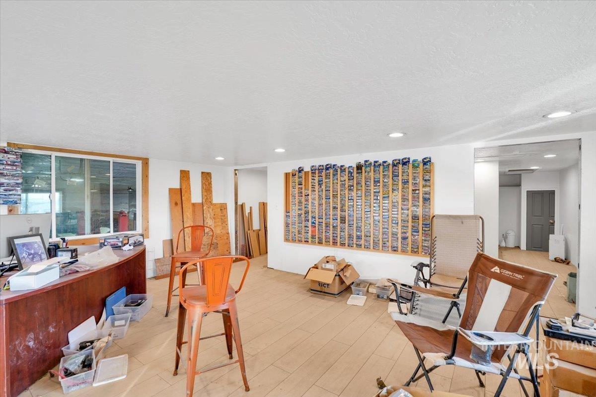 Office area with a textured ceiling and recessed lighting