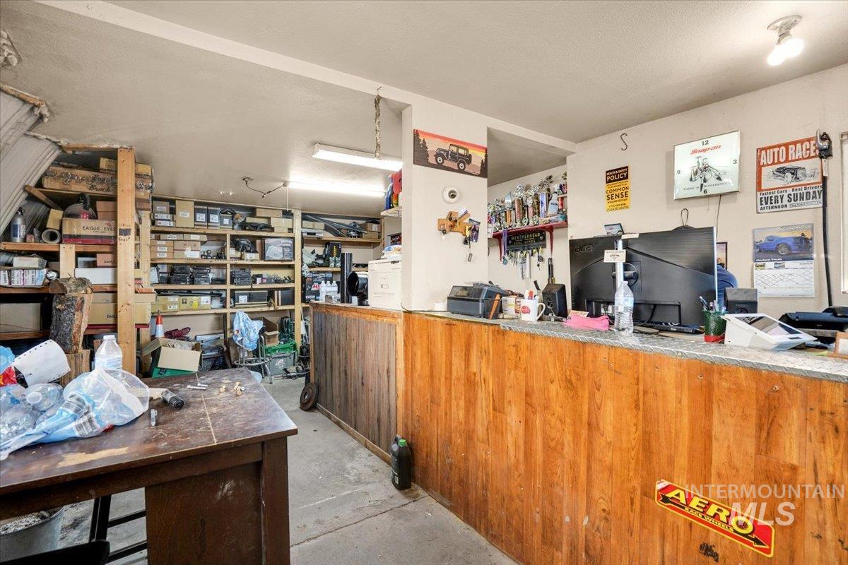 Miscellaneous room with a textured ceiling