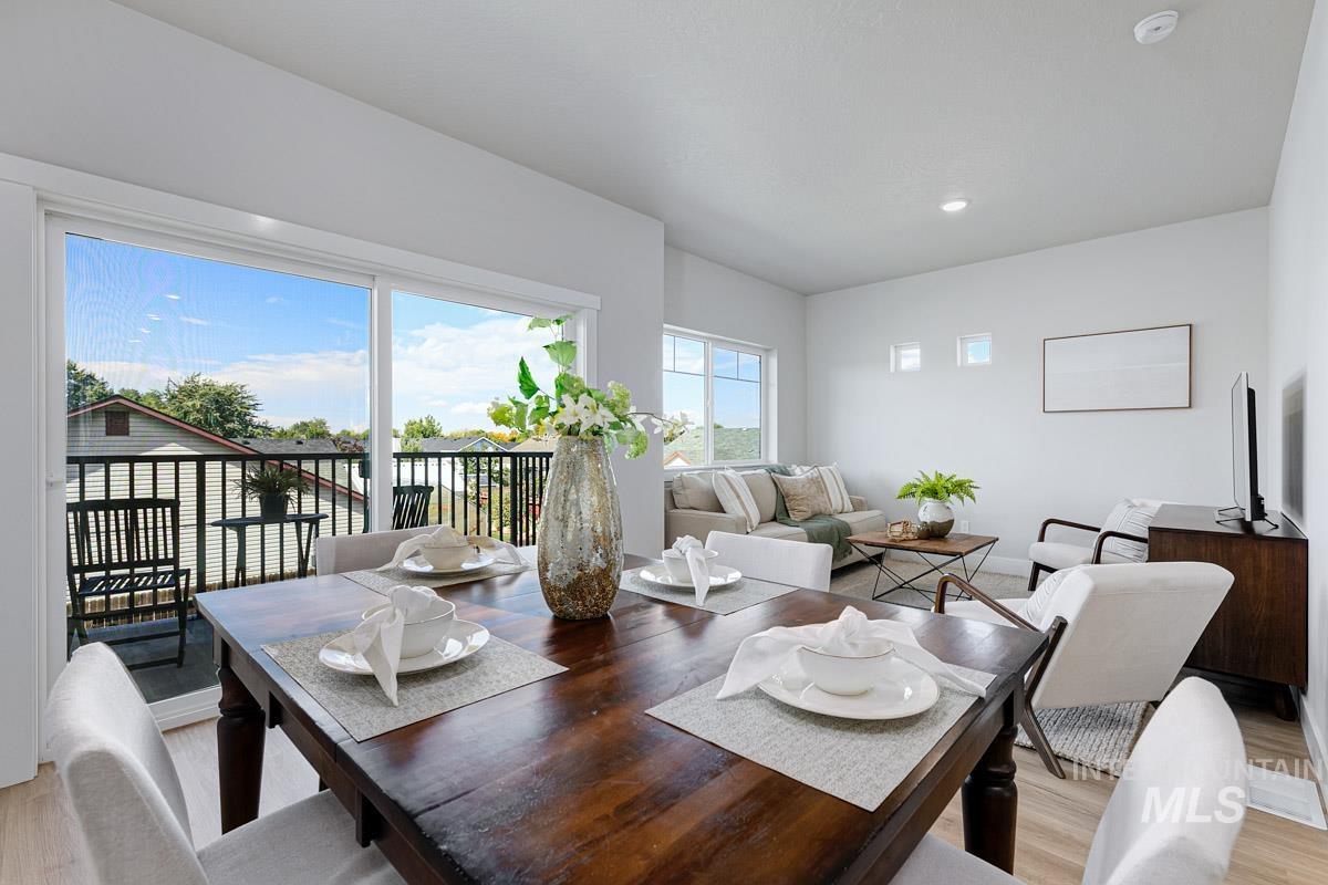 Dining room featuring light wood finished floors and recessed lighting