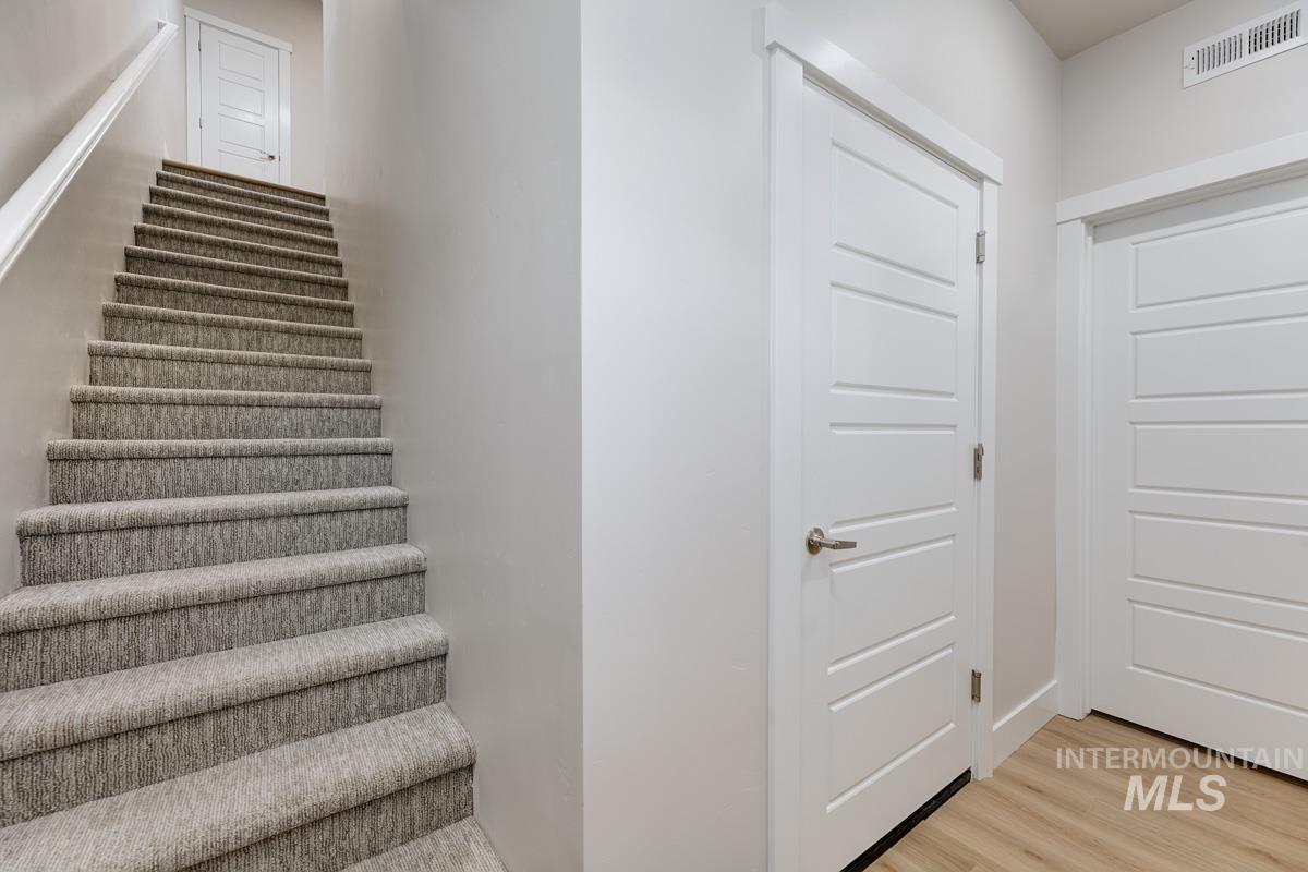 Stairway with wood finished floors