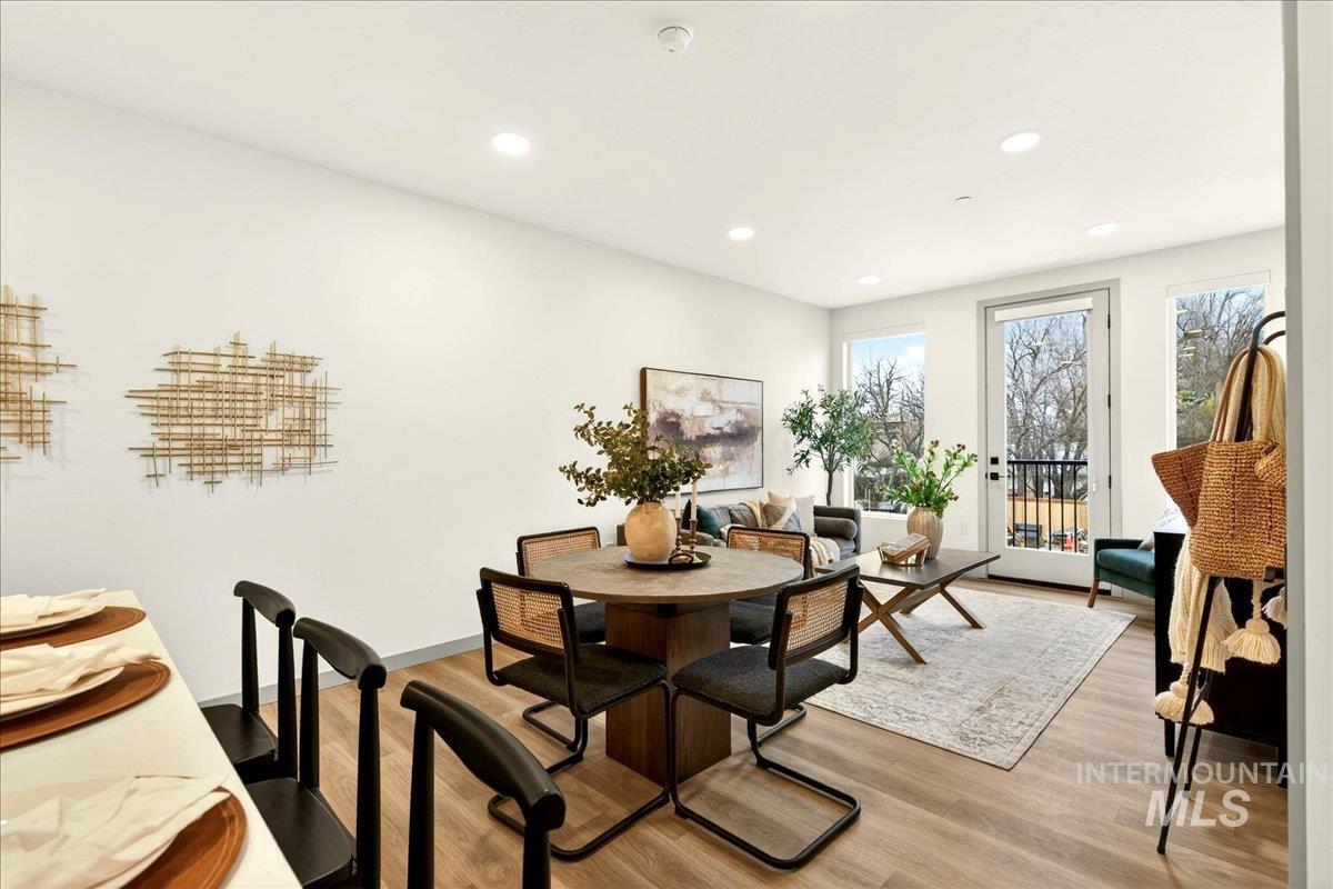 Dining room featuring light wood finished floors and recessed lighting