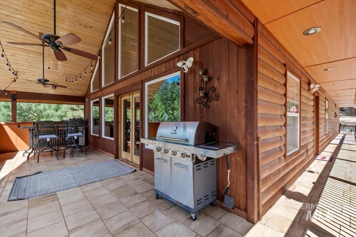 View of patio / terrace featuring a ceiling fan and grilling area