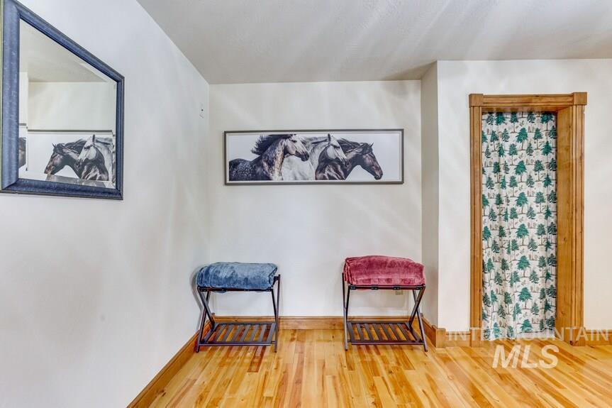 Sitting room featuring wood finished floors and baseboards