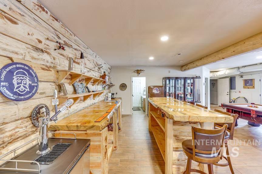 Kitchen featuring light wood-style flooring, a center island, recessed lighting, and billiards table