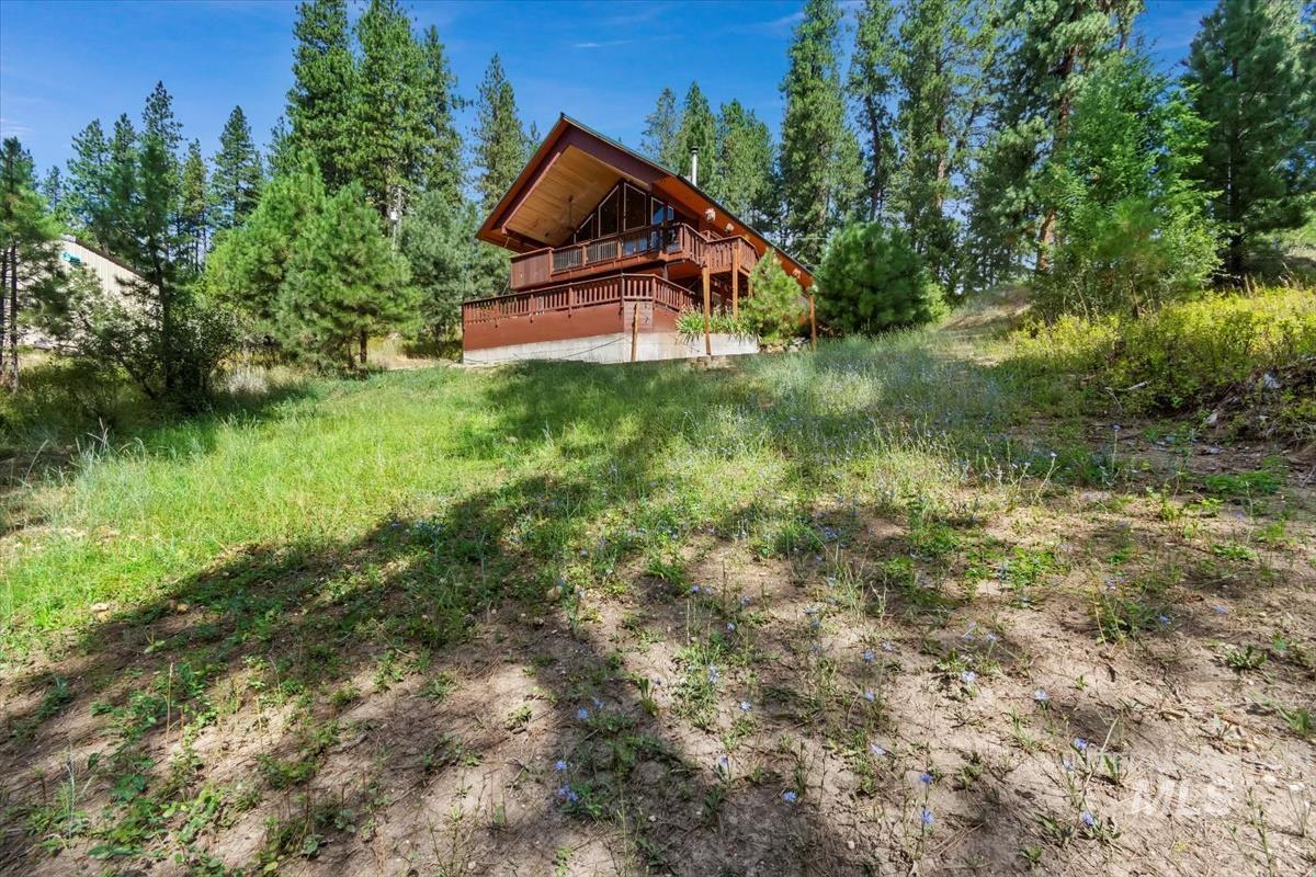 View of yard featuring a wooden deck