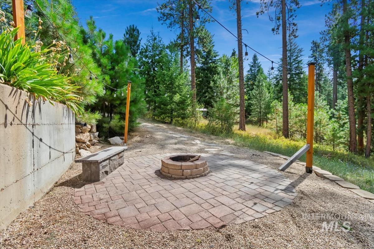 View of patio featuring a fire pit