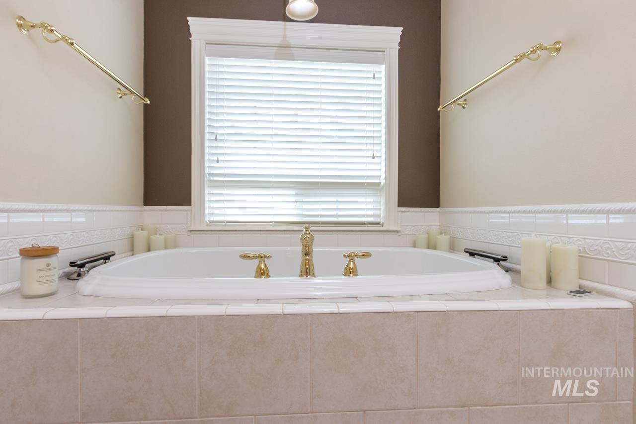 Full bathroom featuring a garden tub