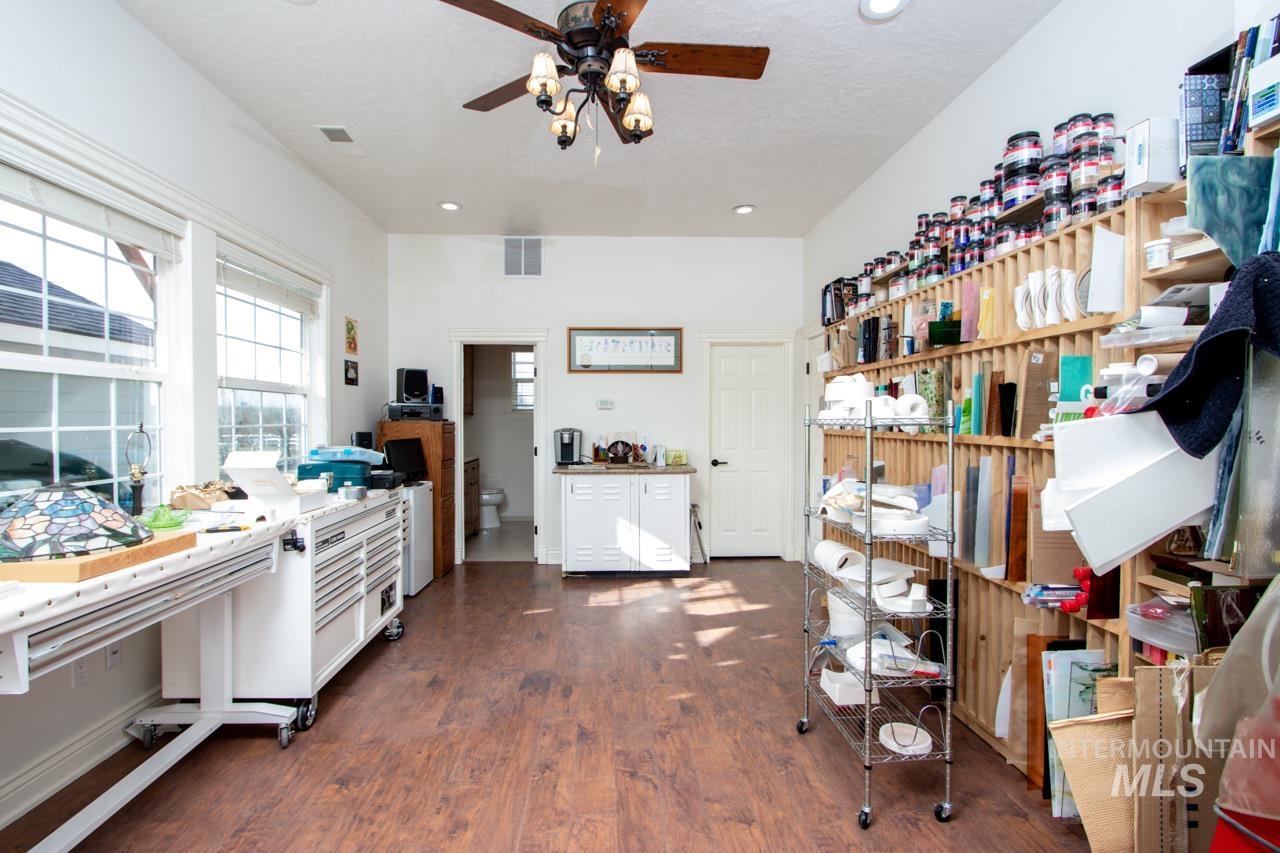 Kitchen featuring ceiling fan, dark wood-type flooring, white cabinets, and recessed lighting