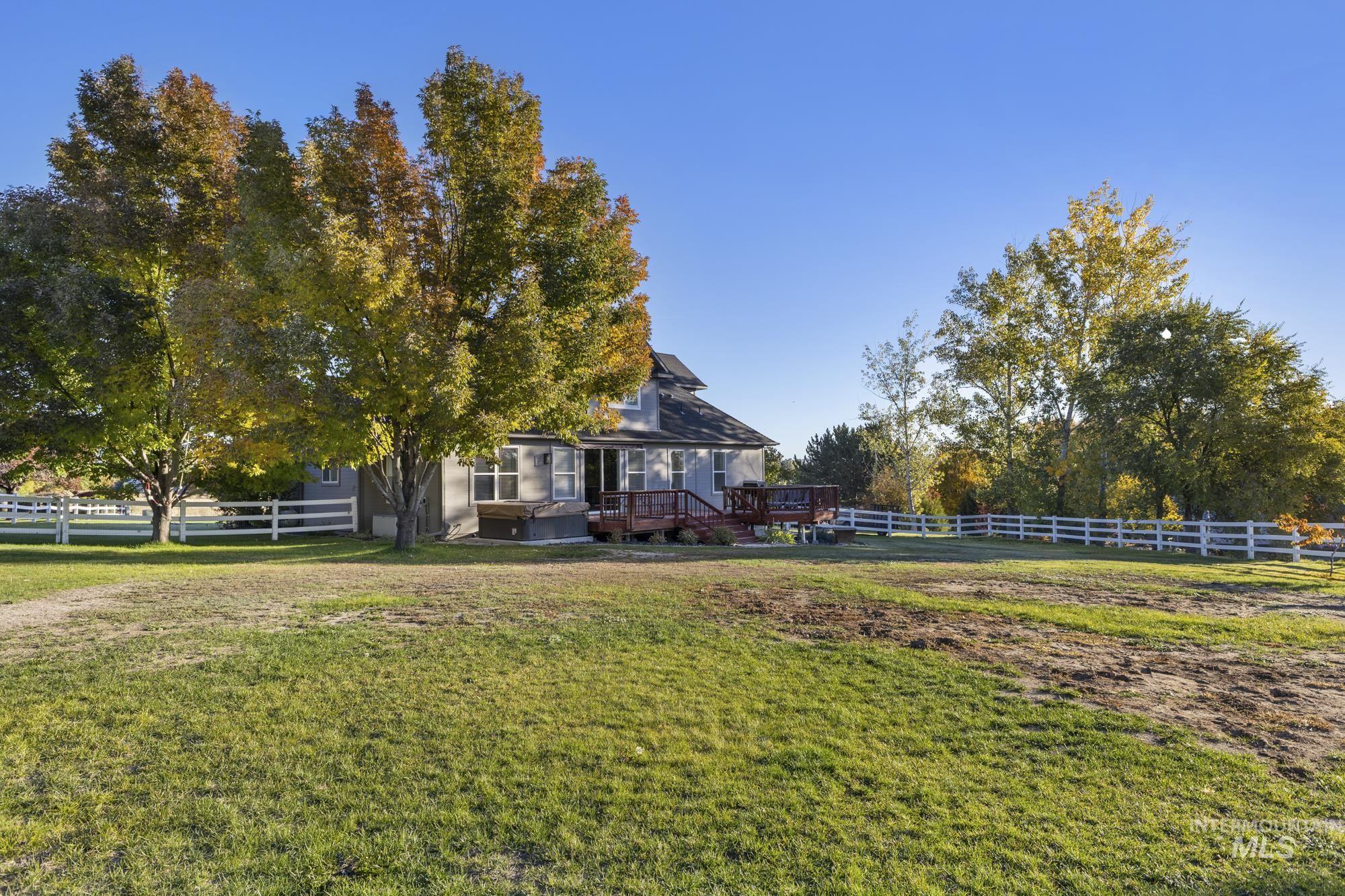 View of yard with a wooden deck