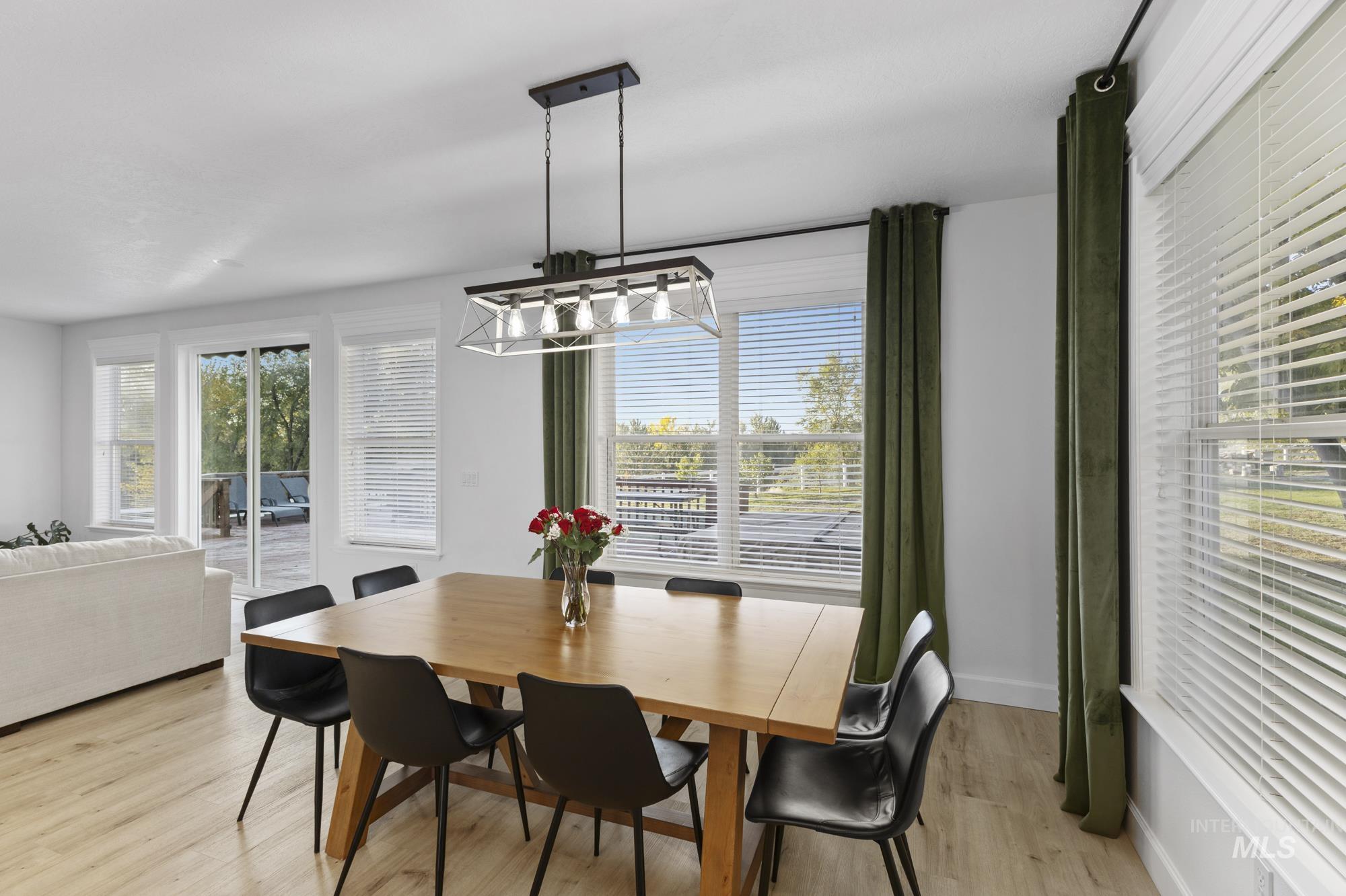 Dining room featuring light wood finished floors and baseboards