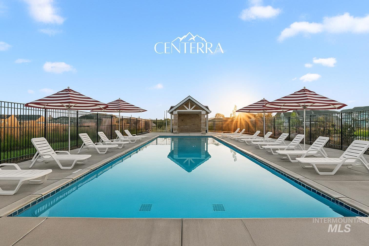 Community pool with a patio