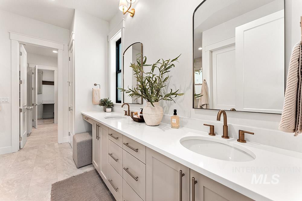 Bathroom featuring double vanity and recessed lighting