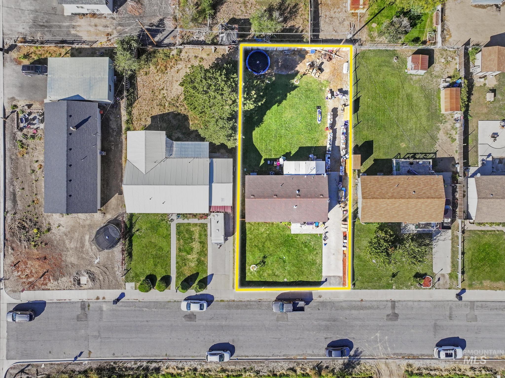 Aerial view of residential area with property parcel outlined
