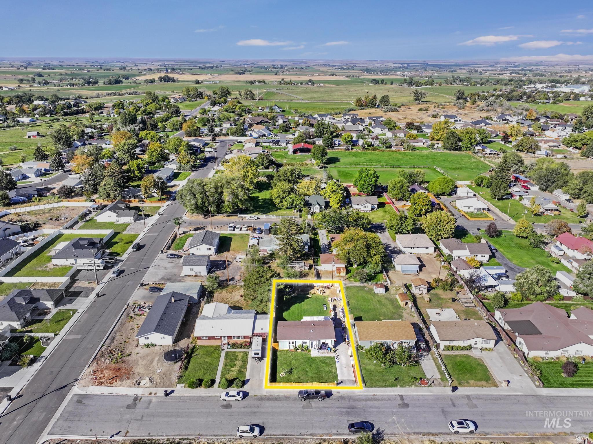 Aerial view of property's location featuring property boundaries highlighted and nearby suburban area