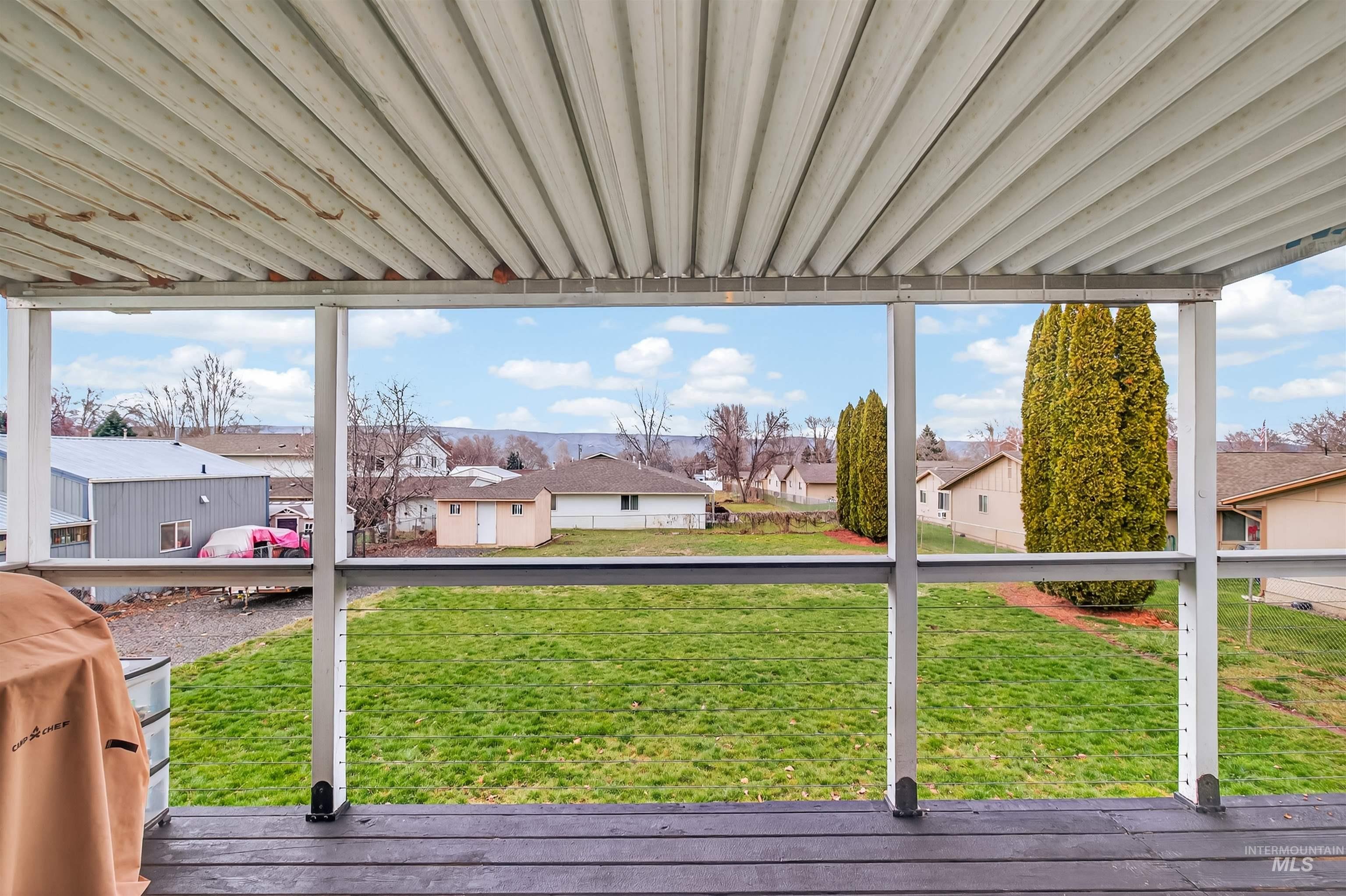 View of grassy yard featuring a residential view