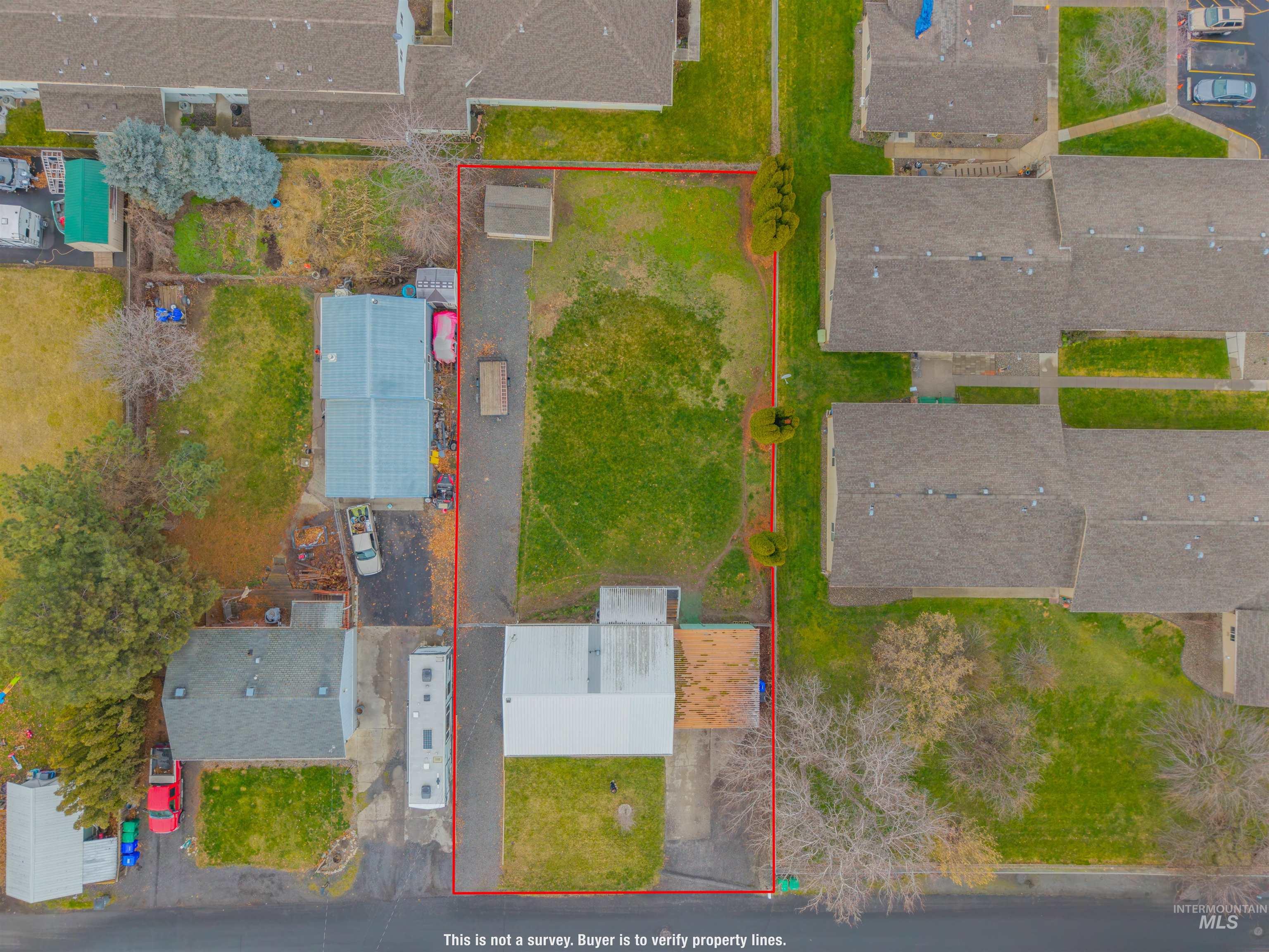 Aerial view of residential area with property boundaries highlighted