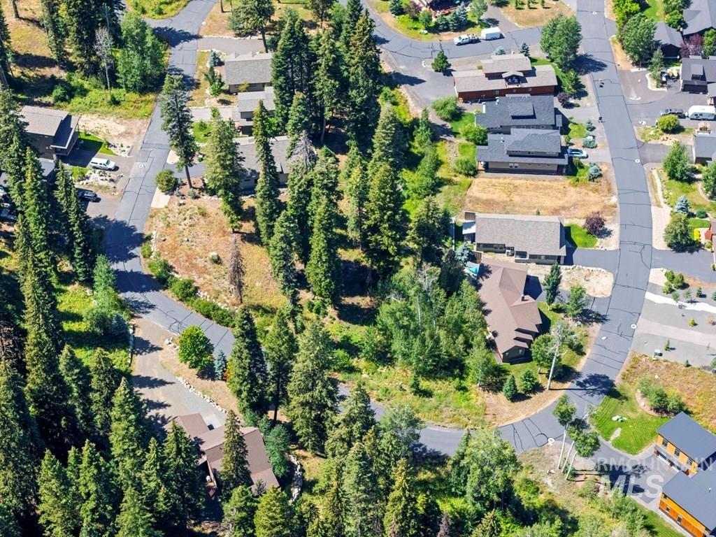 Aerial view of property's location featuring nearby suburban area