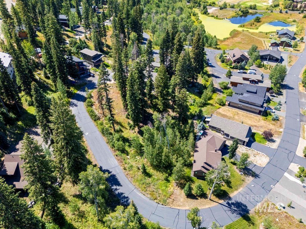 Aerial view of property's location featuring nearby suburban area