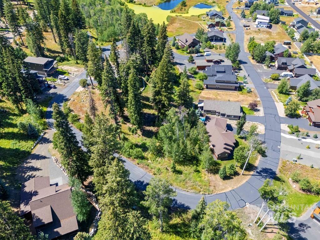 Aerial overview of property's location with nearby suburban area and a nearby body of water