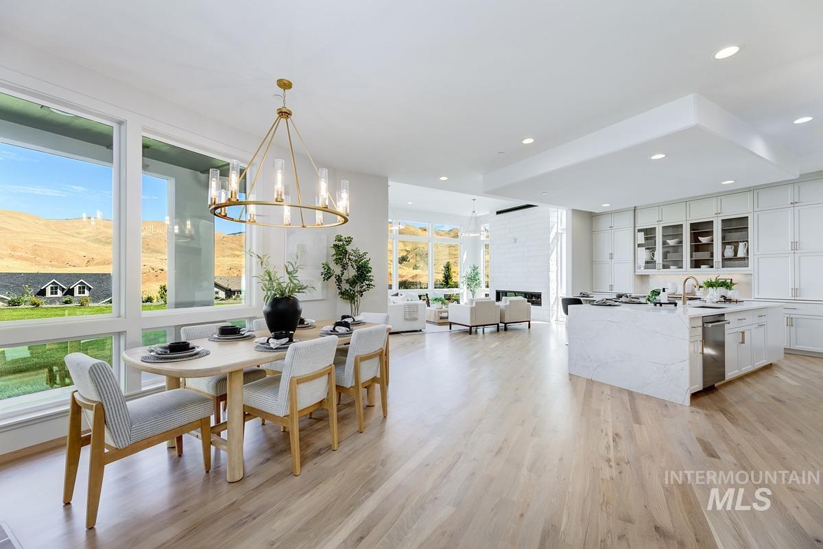 Dining area featuring a chandelier and light wood finished floors