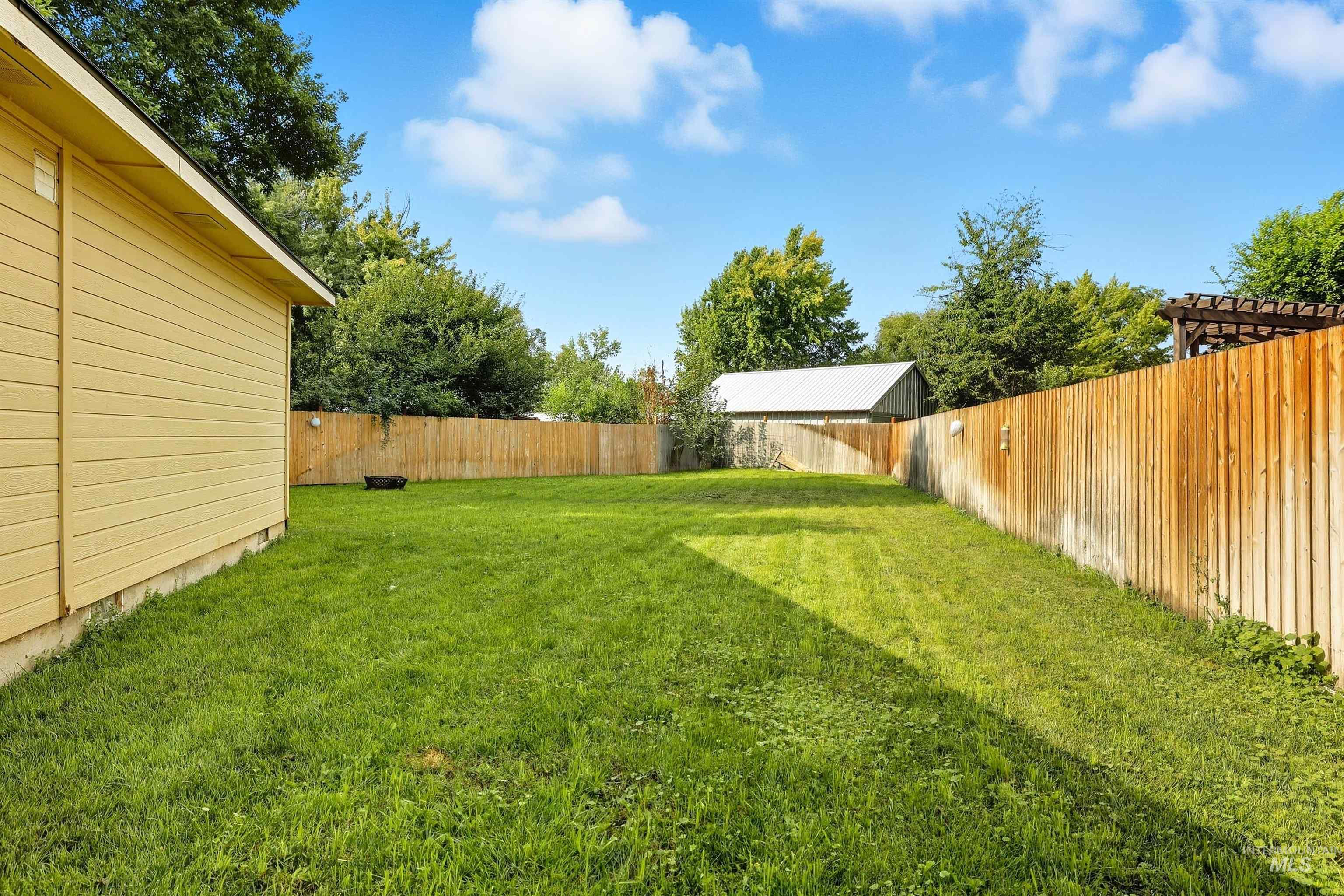 View of fenced backyard