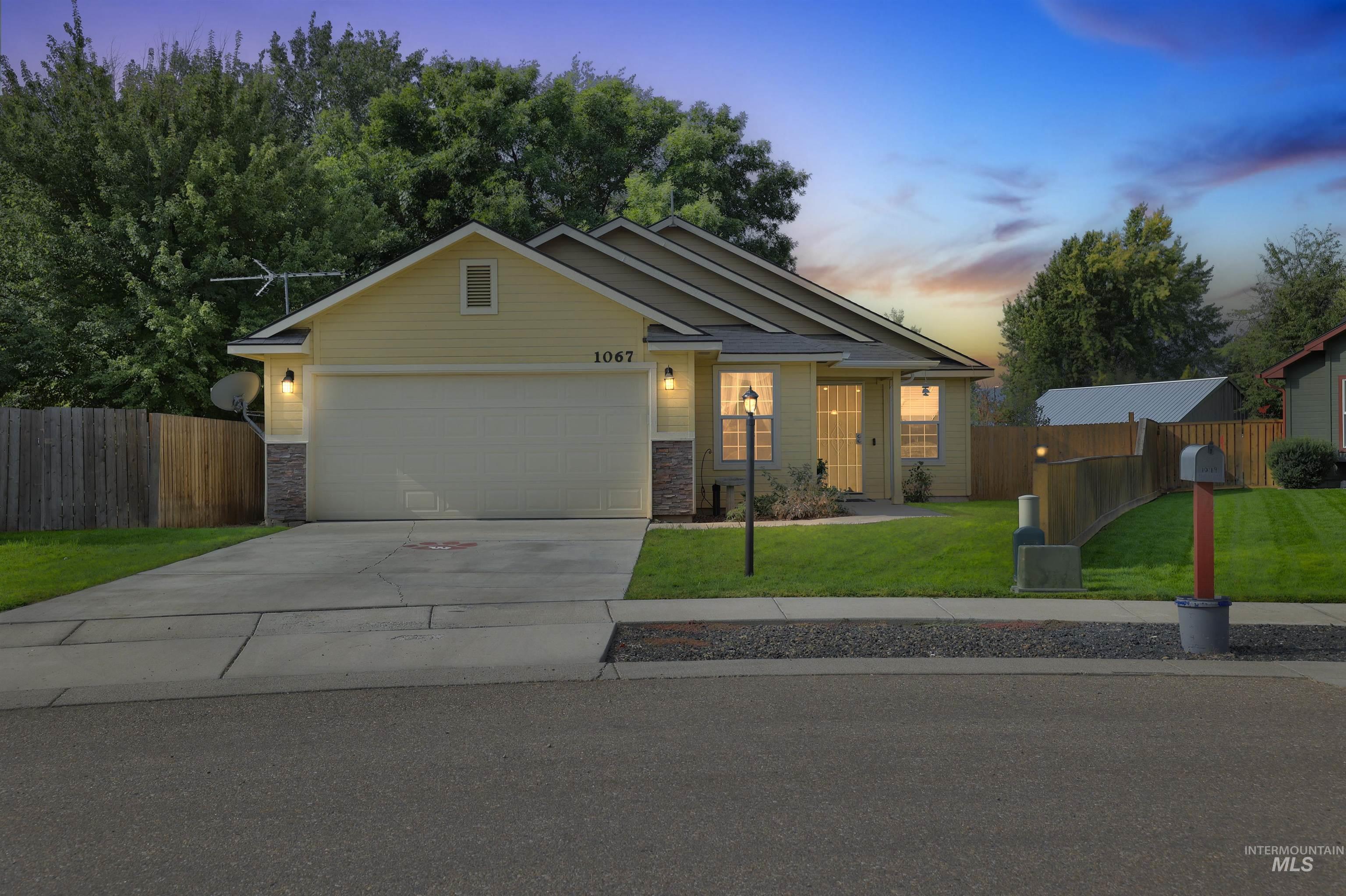 Craftsman house featuring concrete driveway, an attached garage, and stone siding