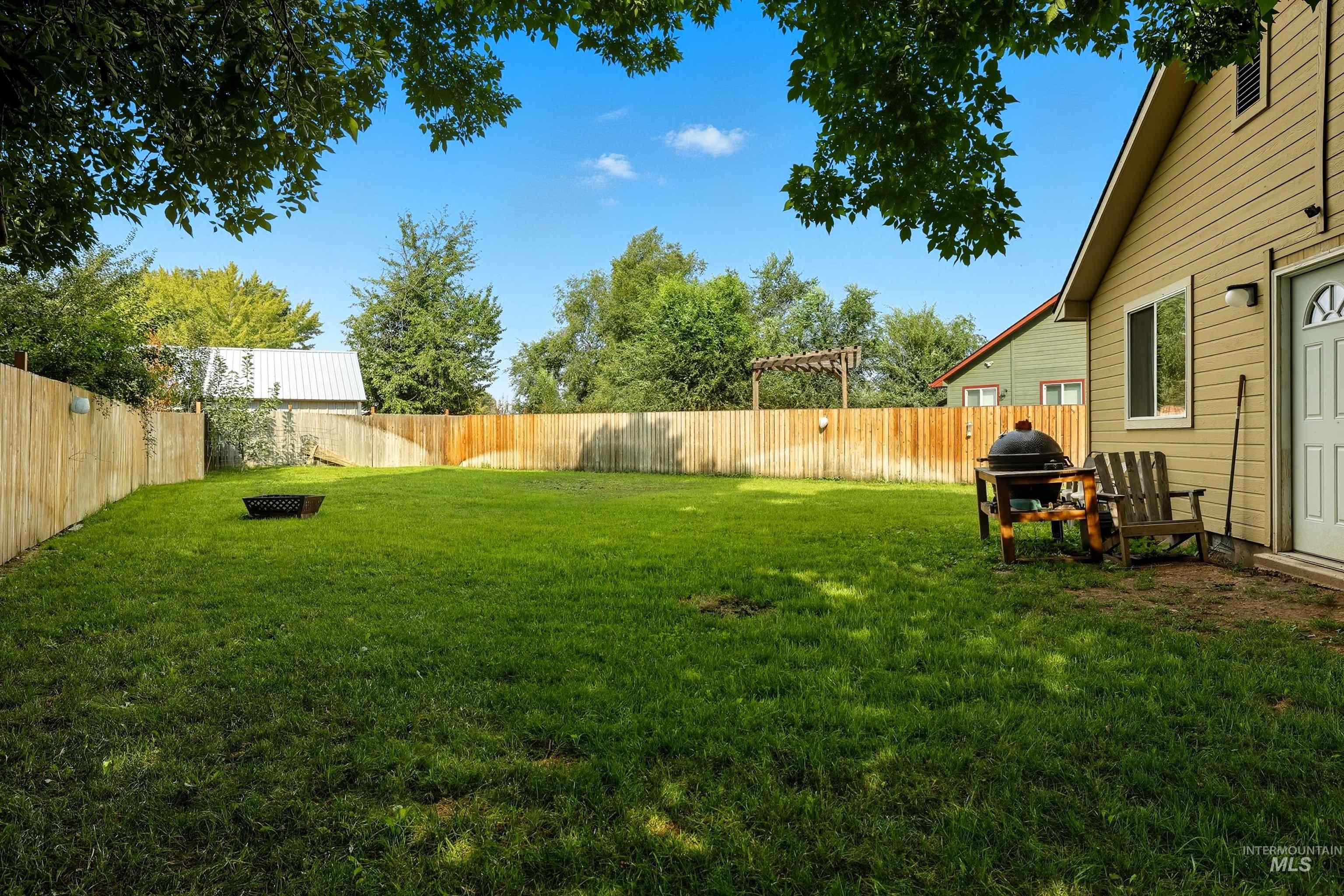 View of fenced backyard