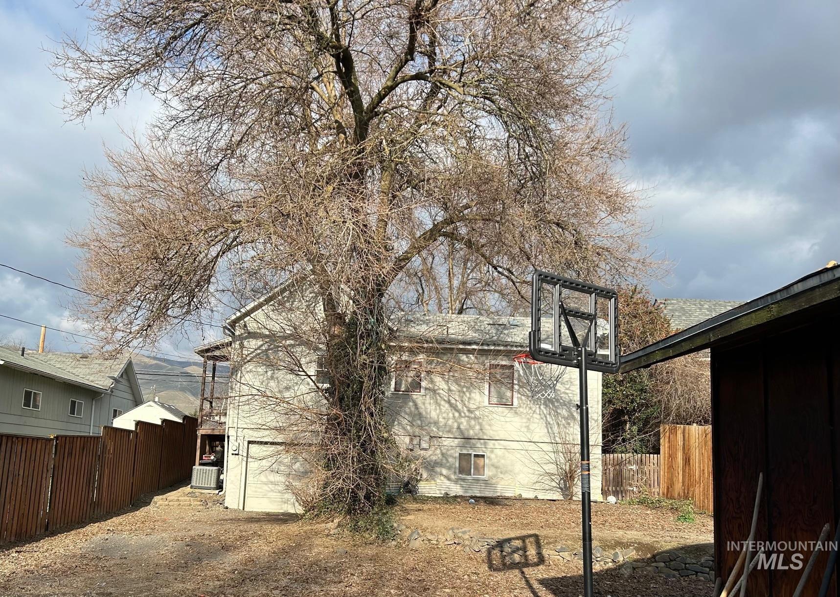 View of property exterior featuring a central AC unit