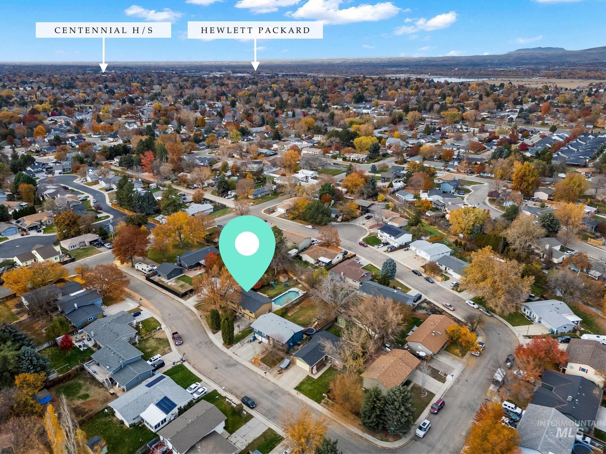 Aerial overview of property's location with nearby suburban area