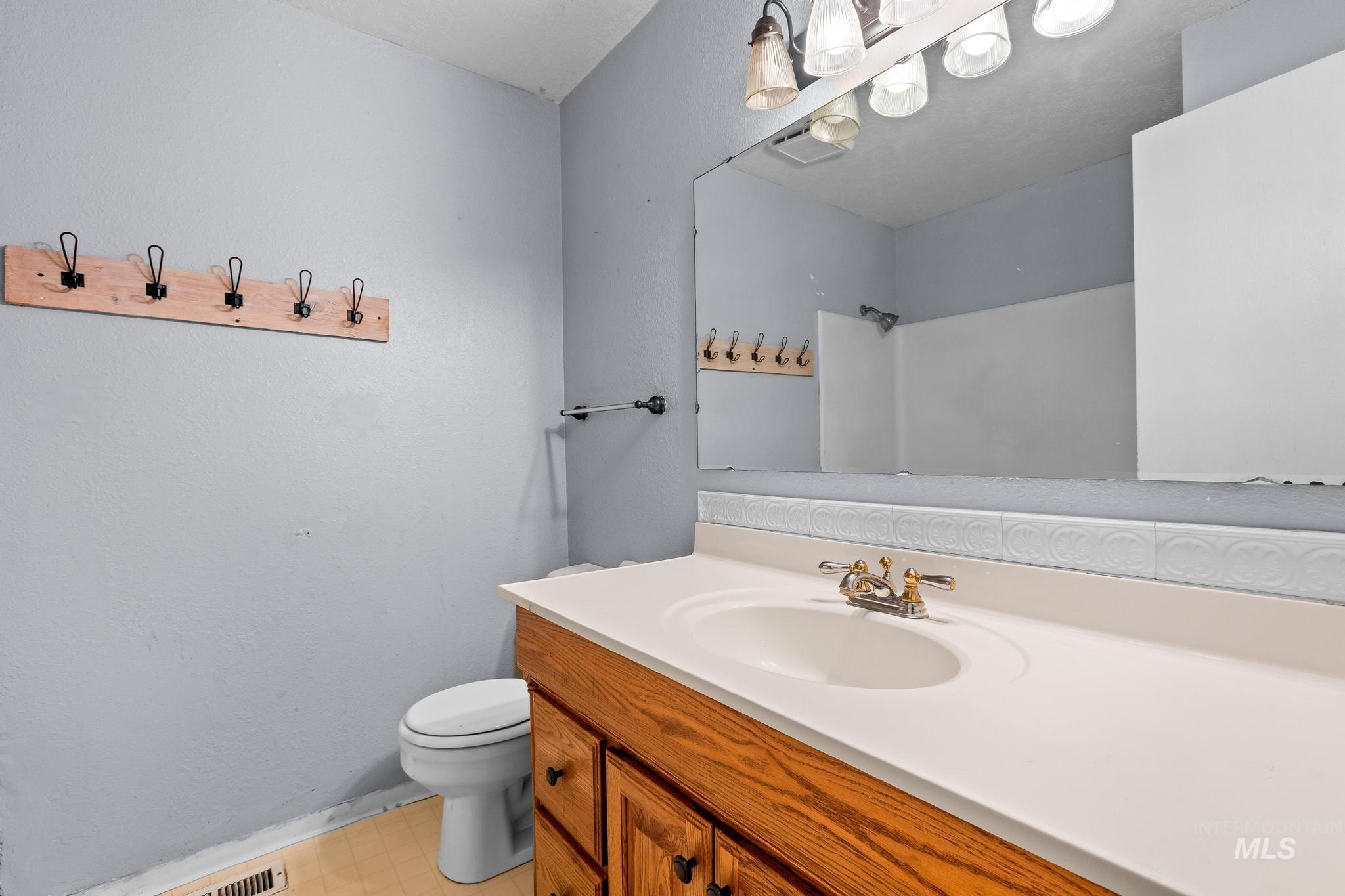 Full bathroom featuring vanity and a shower