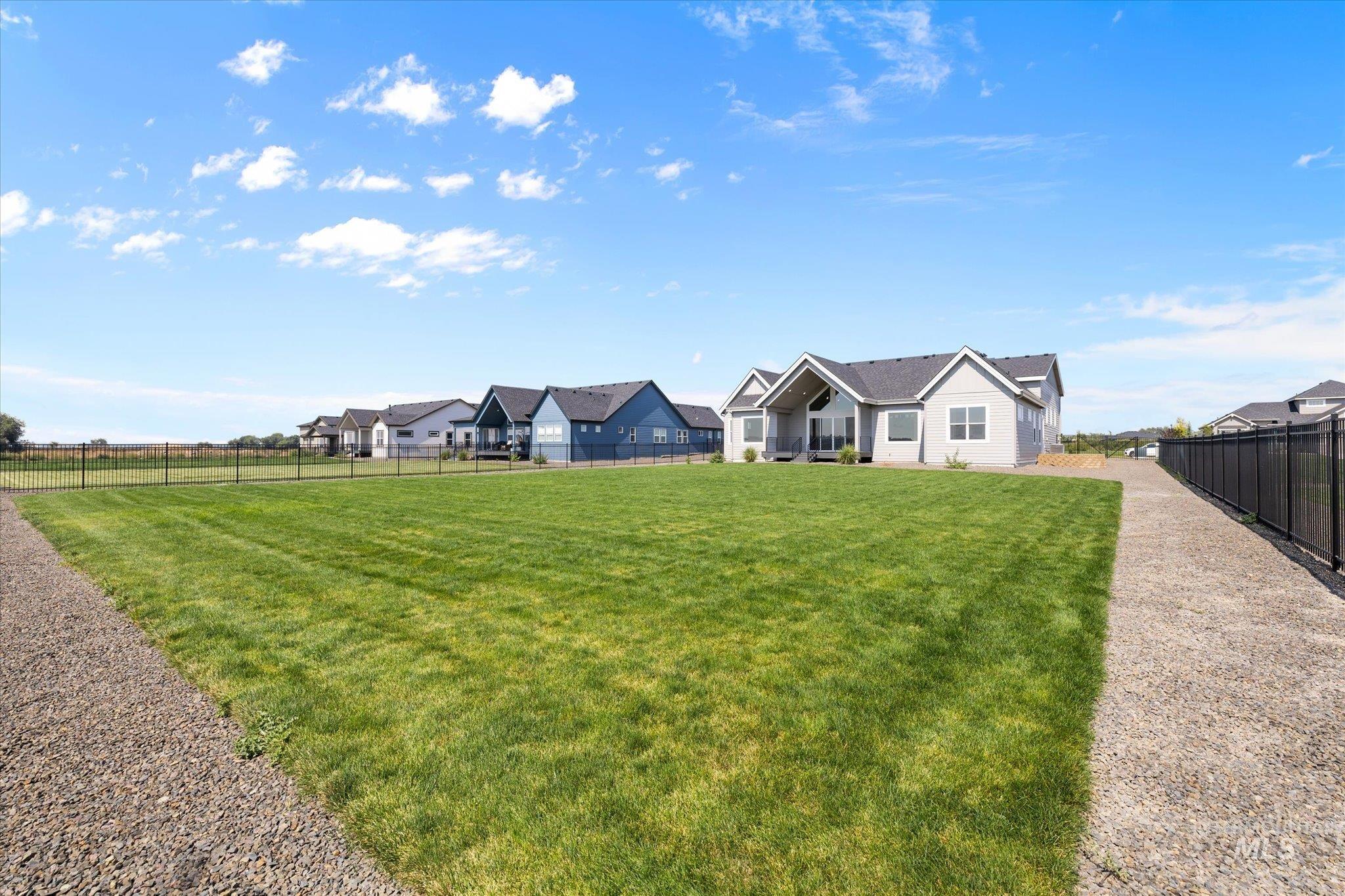 View of fenced backyard