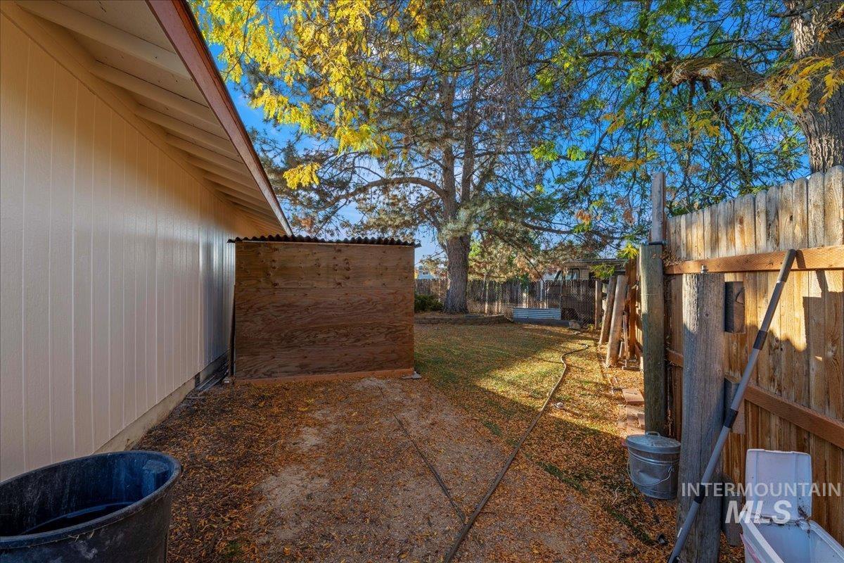 View of fenced backyard