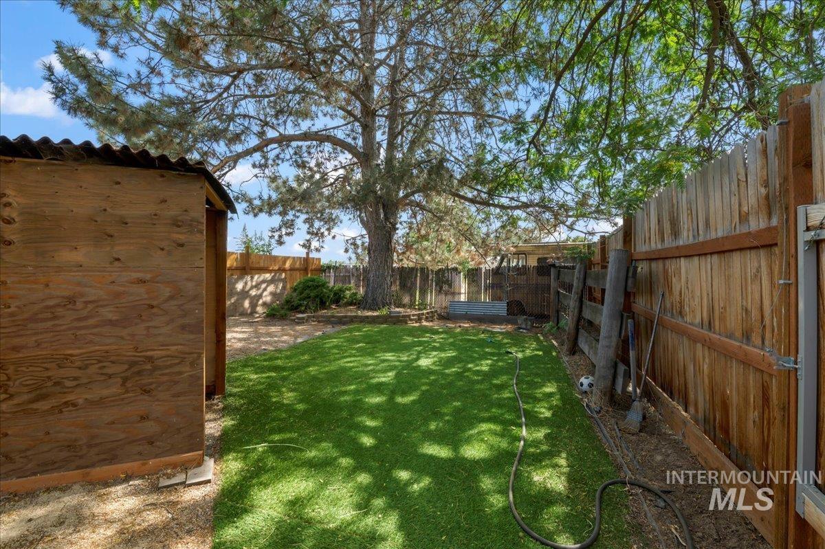 View of fenced backyard