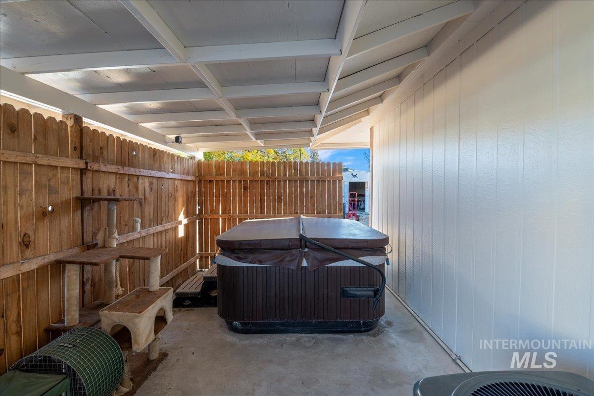 View of patio featuring a hot tub