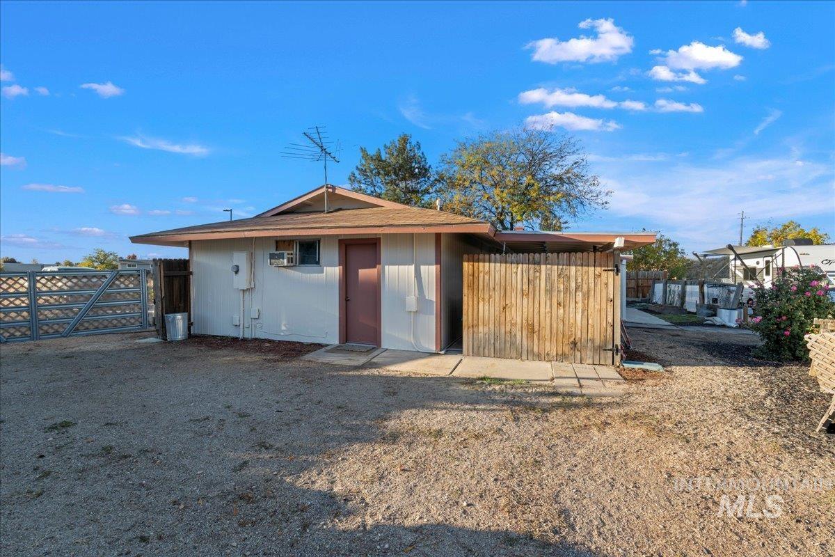 View of outdoor structure with a gate