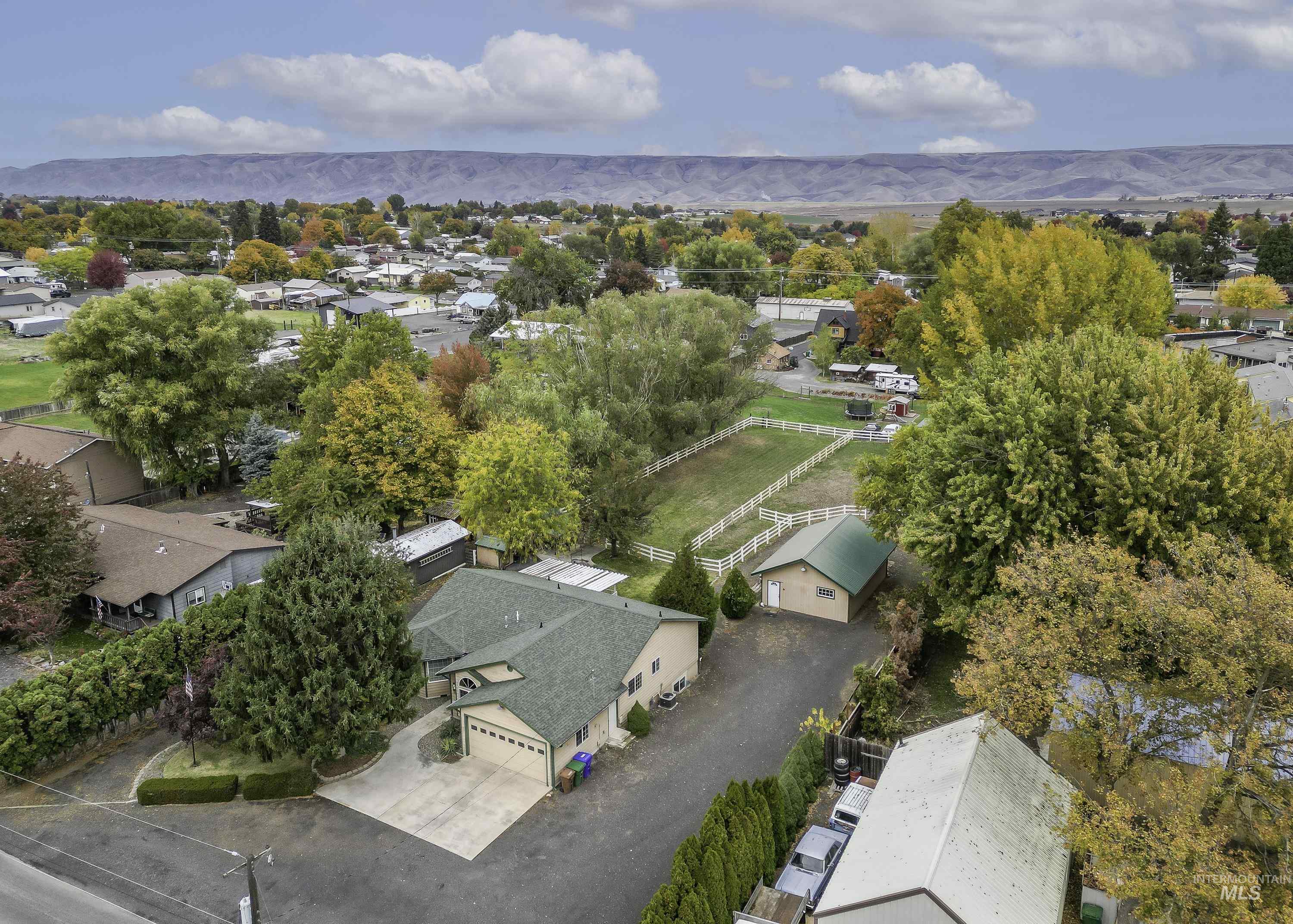 Aerial perspective of suburban area with a mountainous background
