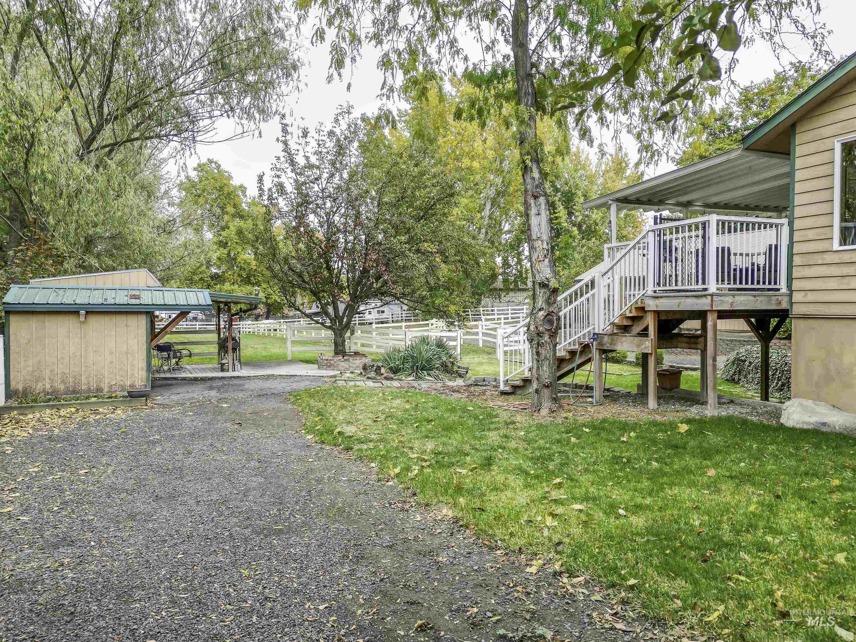 View of yard featuring stairway and a deck