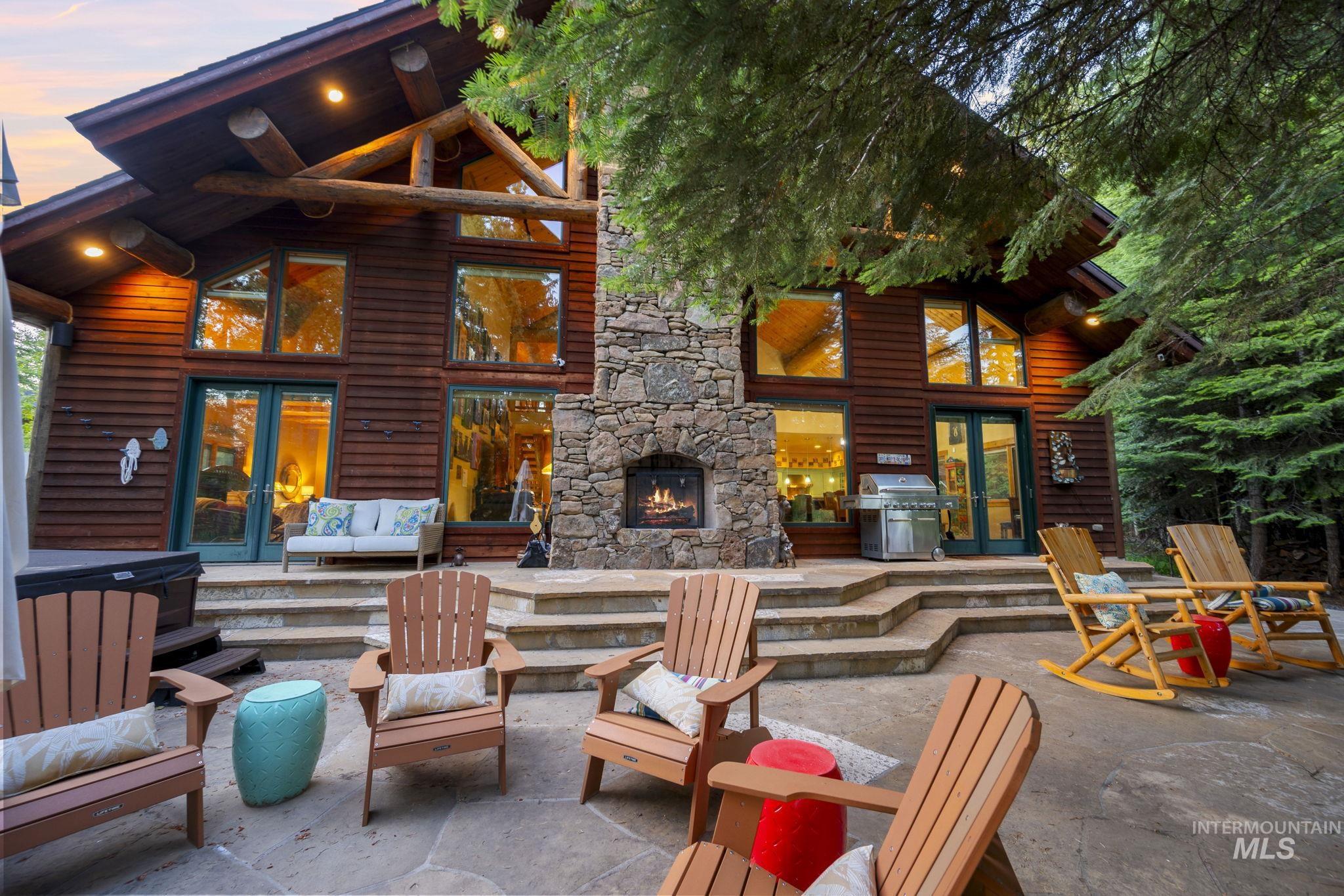 View of patio with french doors, a grill, and an outdoor hangout area