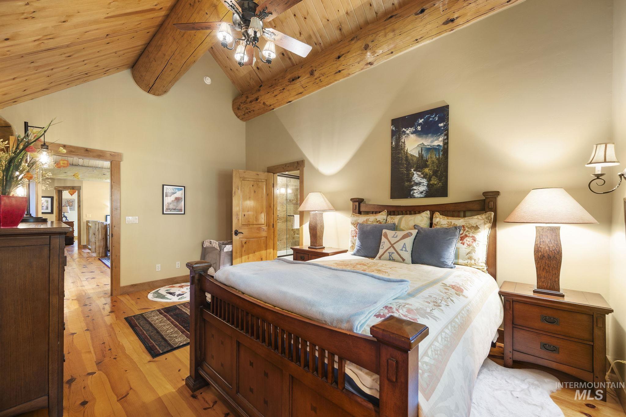 Bedroom featuring high vaulted ceiling, wood-type flooring, a wood ceiling with exposed beams, and ceiling fan