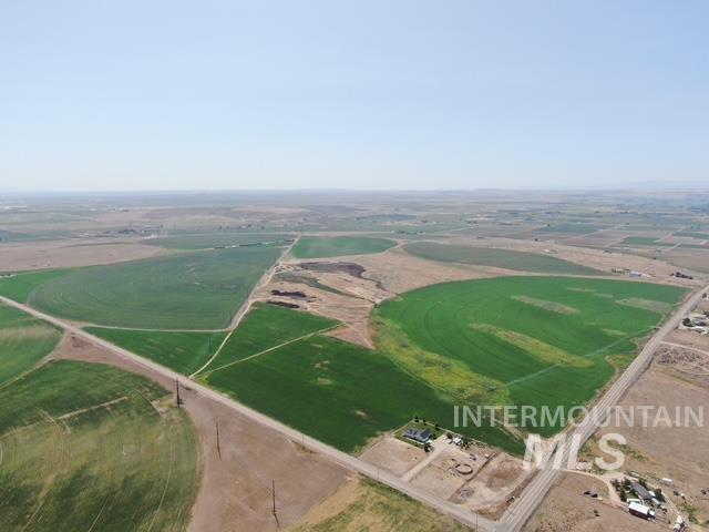 Aerial view of property and surrounding area featuring rural landscape