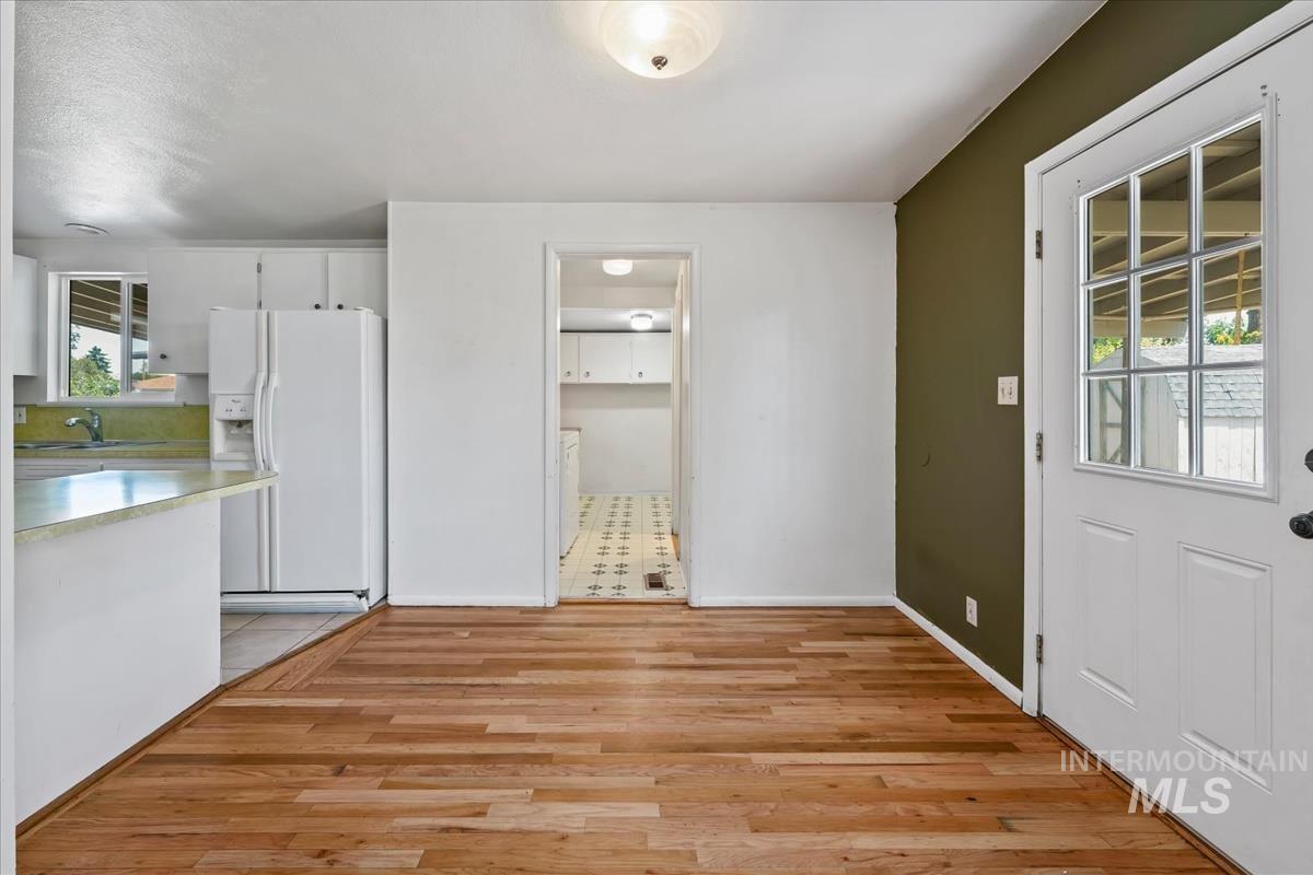 Hardwood-finish flooring extending from the entryway