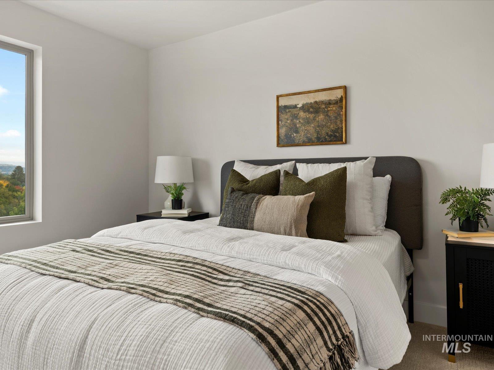 Carpeted bedroom featuring baseboards