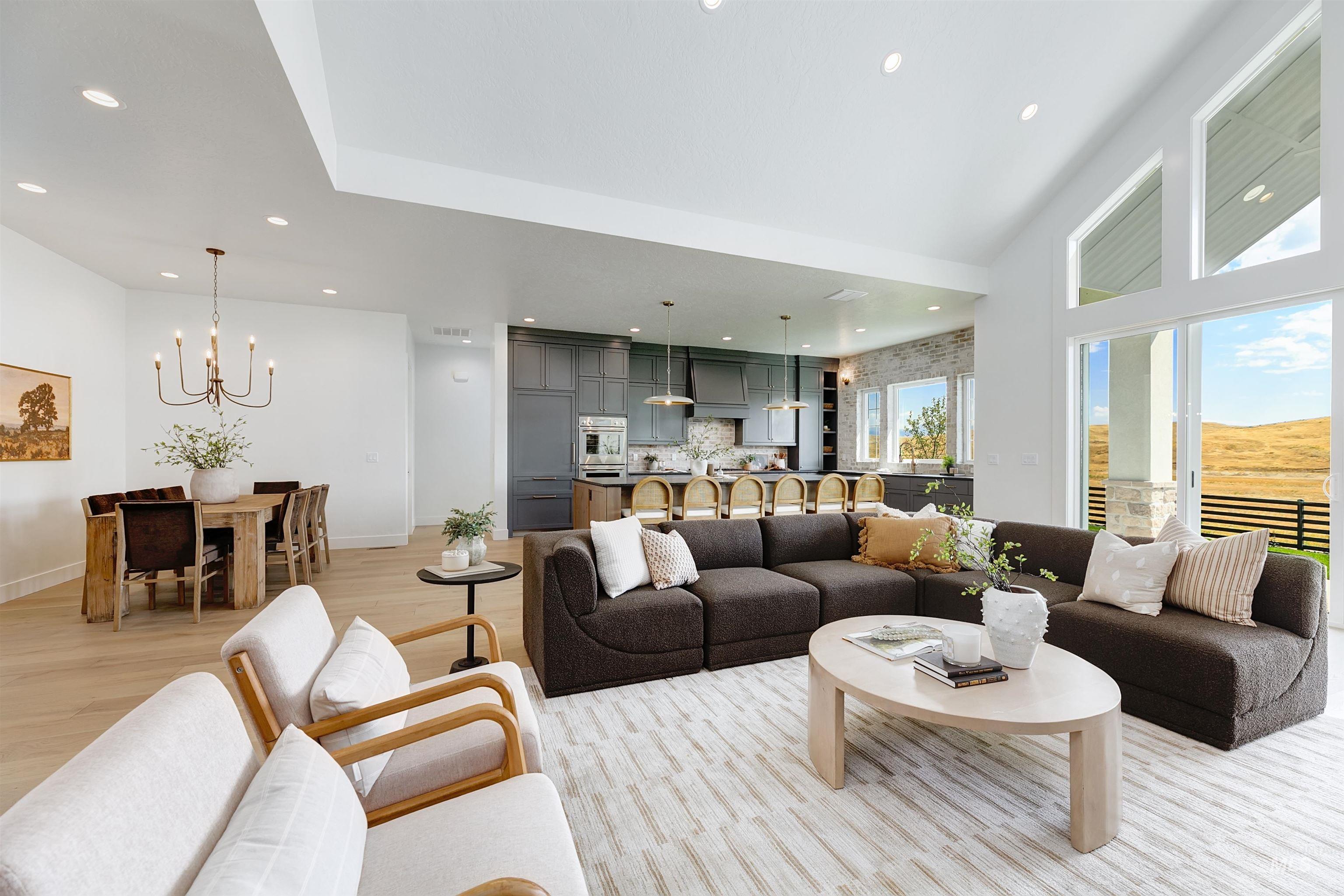 Living room featuring recessed lighting, a chandelier, and light wood-style flooring